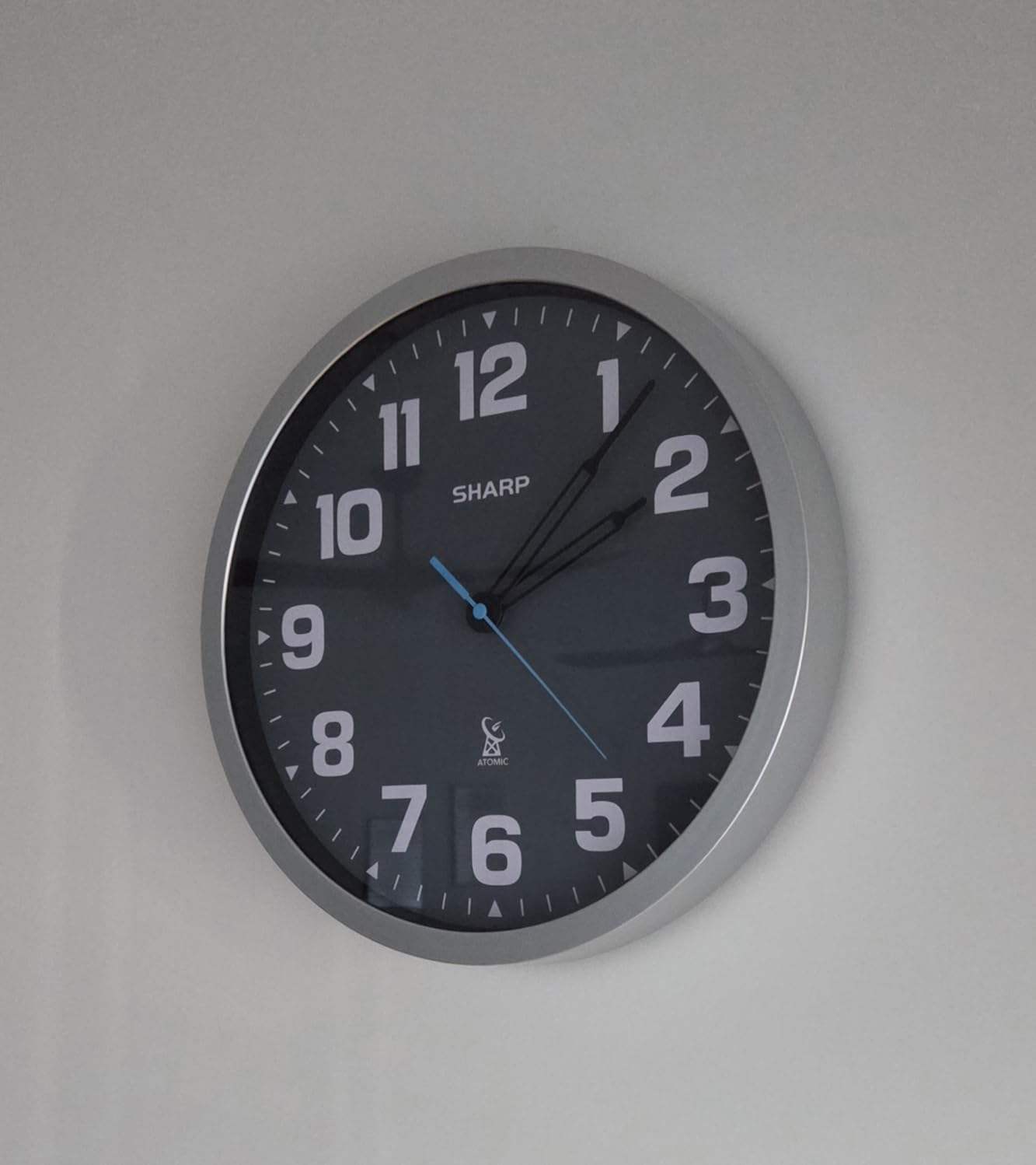 Sharp 12-Inch Atomic Wall Clock, Battery Operated, Glow in Dark | Self-setting atomic time; Easy-read analog face; Automatic time adjustment; Simple setup; Versatile home or office style customer photo 1